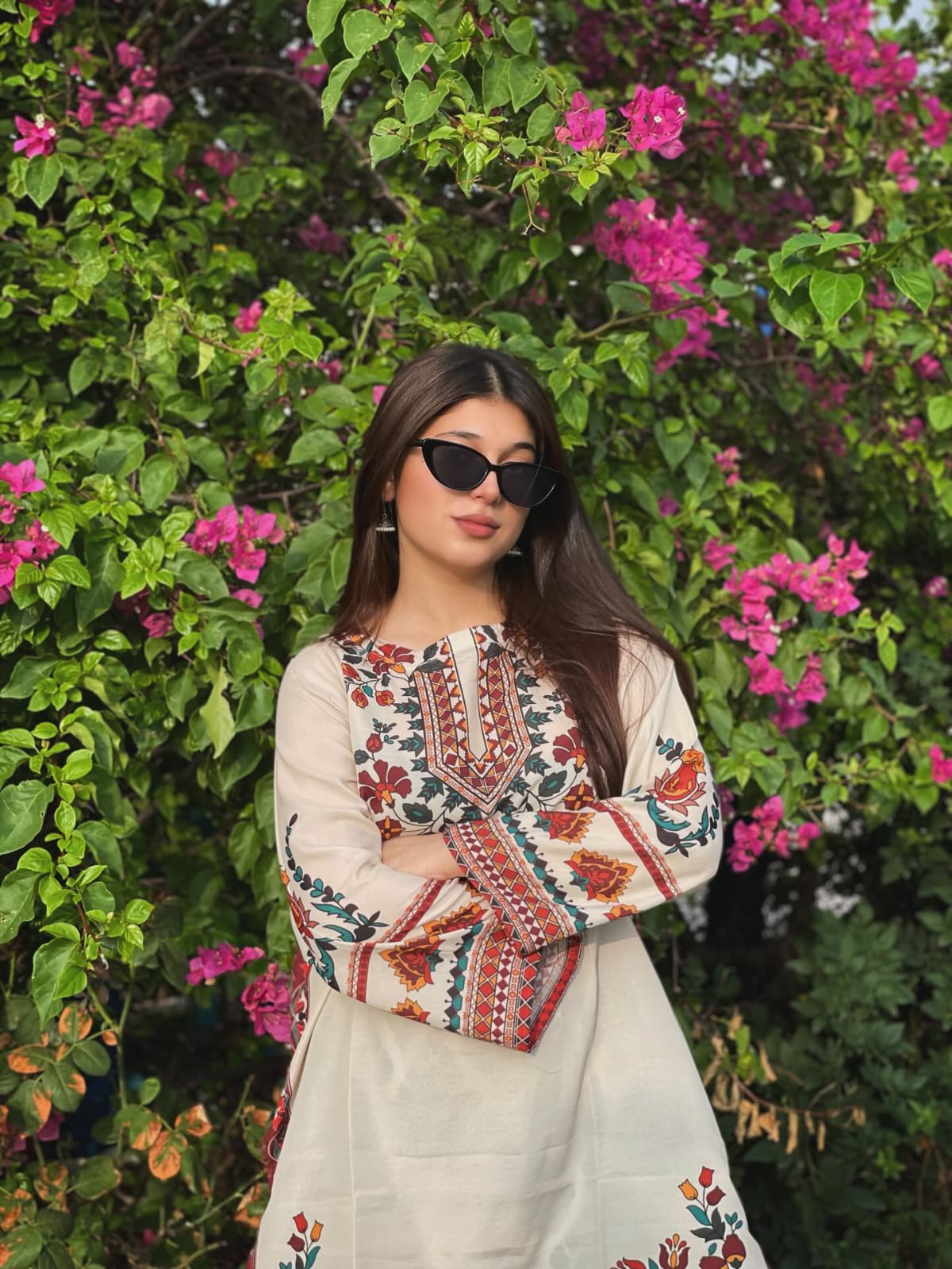 Woman in Floral Embroidered Kurti by a Pond