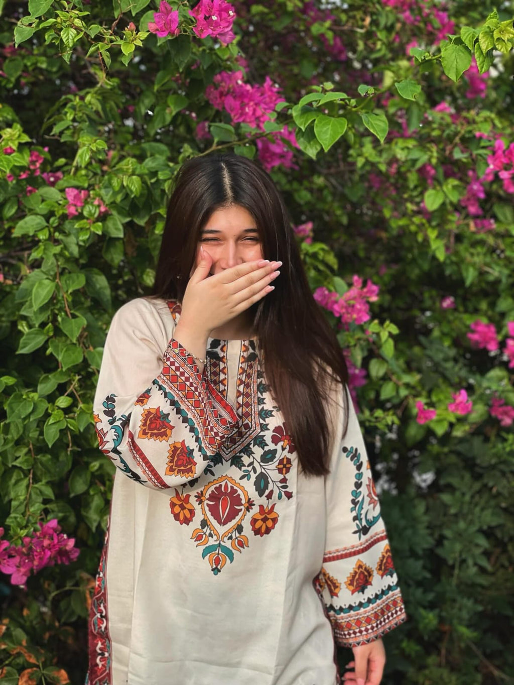 Woman in Floral Embroidered Kurti by a Pond