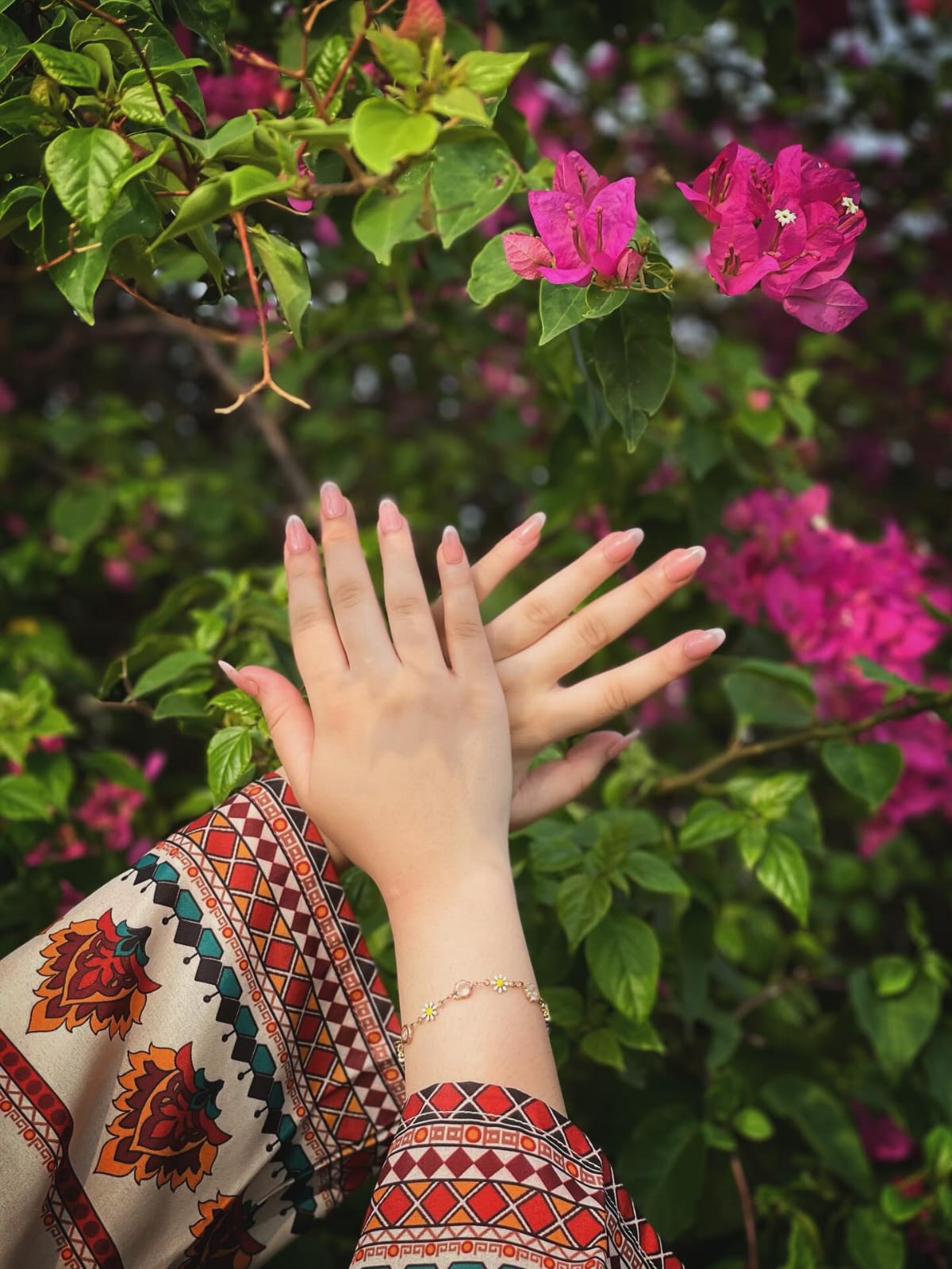 Woman in Floral Embroidered Kurti by a Pond